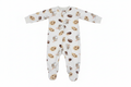 White baby footed pajama sleeper with cookies and milk print on white background