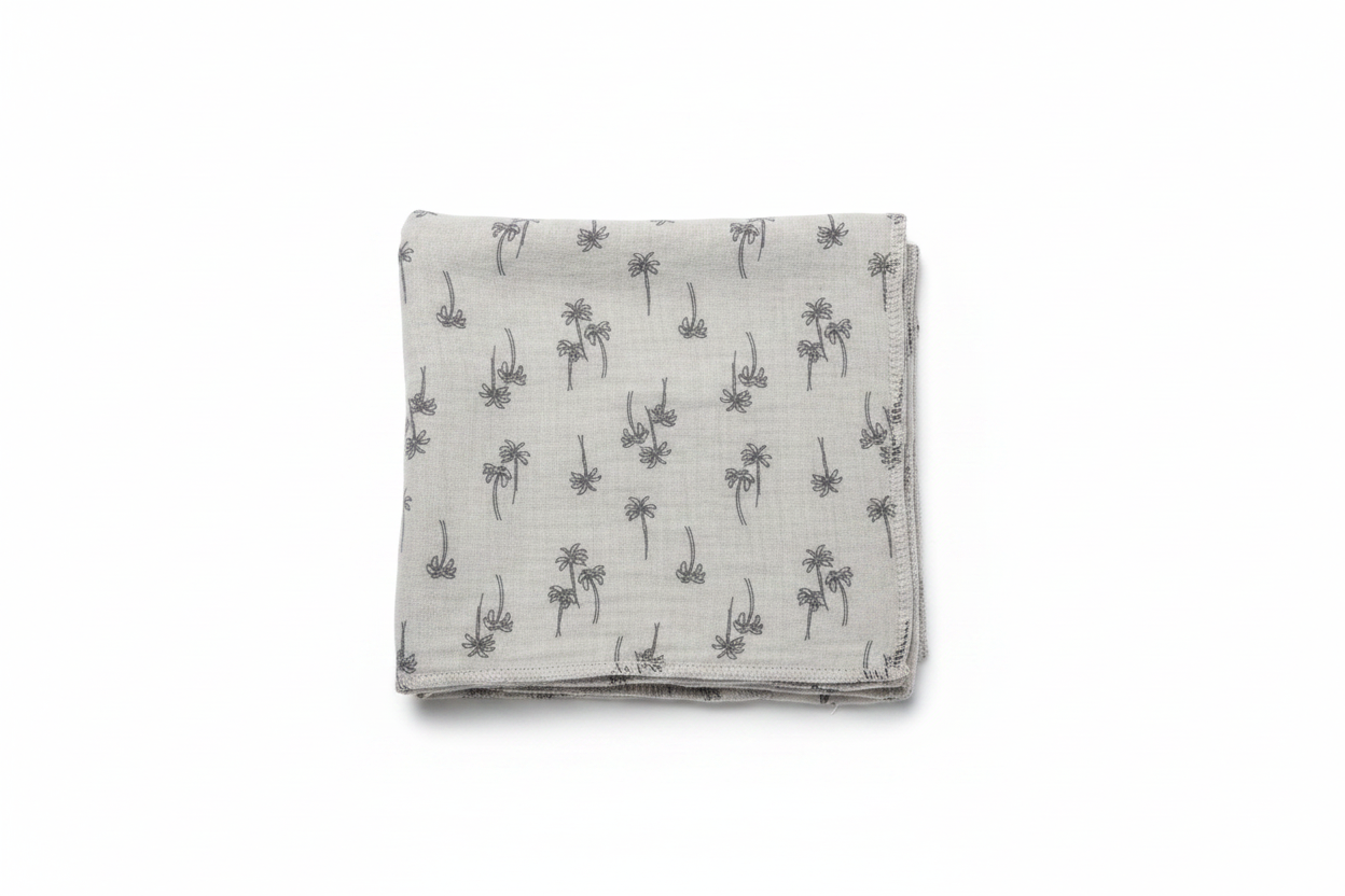 Gray palm tree print baby swaddle blanket on white background