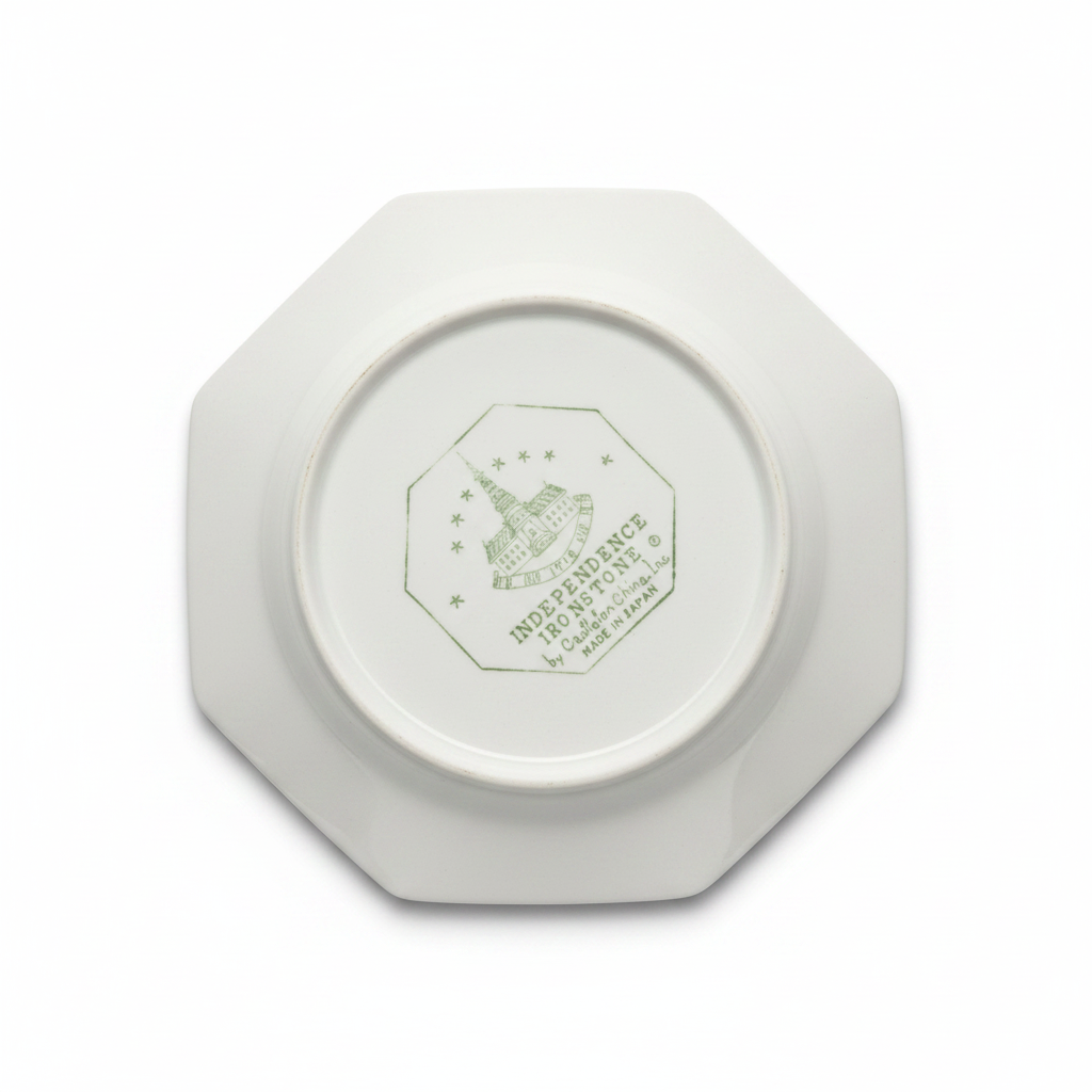 Back of vintage octagonal ceramic plate showing maker's mark, white background